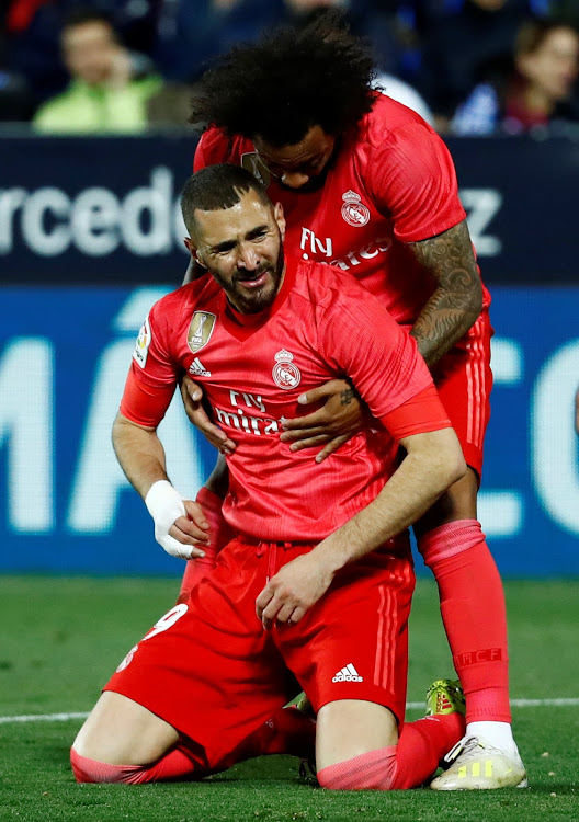 Madrid's Karim Benzema reacts with Marcelo REUTERS/Juan Medina