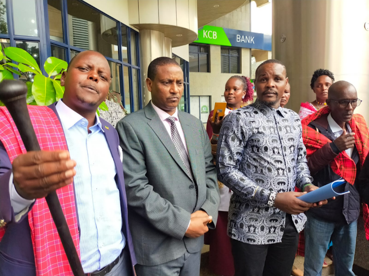 Ben Kaete from Namuncha Maasai community, NEMA director general Mamu Boru and Environment PS Festus Nge’no when the Maasai community presented a petition at the ministry's headquarters on September 8, 2023.