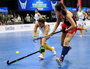 SA player Jessica Lardant battles for possession against 14-year-old Reece D'ariano of the US in their Indoor Hockey World Cup match at Heartfelt Arena in Pretoria on Tuesday morning. 