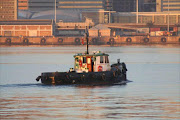 The Cape Town harbour launch Troupant, which capsized on Saturday leaving its skipper missing and two crew members in hospital.