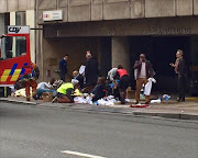 Emergency personnel tend to injured people after an explosion at Maelbeek metro station in Brussels, Belgium, 22 March 2016. Brussels has shut down its all of its metro services after blasts occurred on Tuesday in Schuman and Maelbeek metro stations near European Union buildings, local news reports. At least one person was killed and many injured, according to a local witness, although the number of deaths and injuries has not been confirmed by official sources. The blast comes just hours after dozens of people were killed or injured in a double explosion in the departure hall of Zaventem Airport in Brussels.  EPA/FRANCESCO