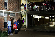 Ayanda Meyer and Selby Cindi,  Forensic Services Officers from Johannesburg Forensic services in Hillbrow, carry away the remains of a dumped foetus, found at Alexander Woman's Hostel. 