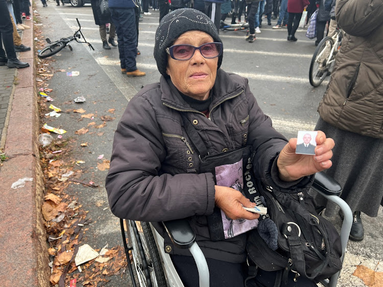 Anna Voskoboinik holds up a picture of her son, who she says was arrested by Russian occupation forces three months ago in the city, in Kherson, Ukraine November 17, 2022.