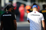 Mercedes GP drivers Lewis Hamilton and Valtteri Bottas walk in the paddock during previews before the F1 Grand Prix of Italy at Autodromo di Monza on September 3 2020 in Monza.