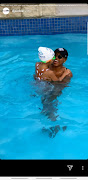 DJ Zinhle swimming with Kairo. 