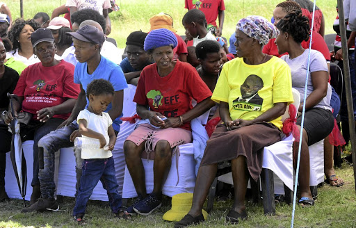 Agnes Mosweu, second from right, the mother to the late Matlhomola Mosweu, during a Human Rights Day event that ended with the handing over of their newly built house in Coligny yesterday.