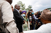 President Cyril Ramaphosa meets people who lost family members during flooding in Clermont, Durban, on April 13 2022. 