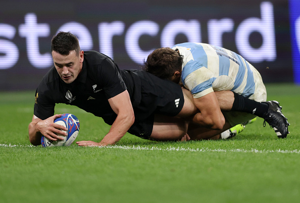 Will Jordan of New Zealand scores one of his three tries during the 2023 Rugby World Cup semifinal against Argentina at Stade de France.