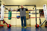 Alan Toweel in his garage,  which  he has turned into a gym to develop young talent. 