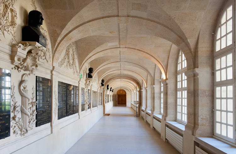 Gallery of the cloister of the church of Val-de-Grâce. The church's dome dome is a notable feature of Paris's skyline.