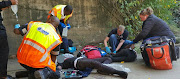 Paramedics treat two Durban schoolboys who fell from a bridge on Friday