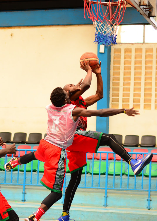 Erick Mutoro challenges Griffin Ligare during a training session at Nyayo Stadium gymnasium