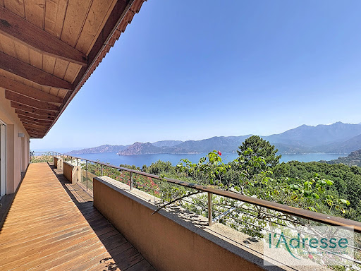 Wooden terrace with sea and mountain view in this luxury villa for sale in Piana ($1,565,544 - 196 m²)