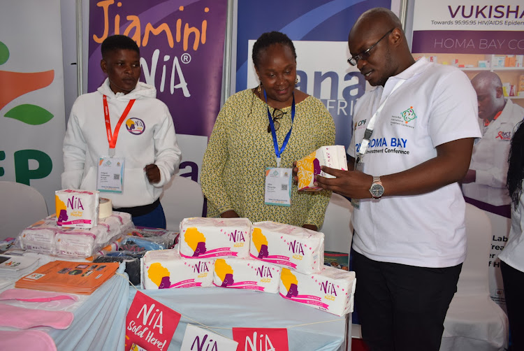 Homa Bay health chief officer Kevin Osuri with Zana Africa programmes manager Alice Onsarigo at Homa Bay international investment conference at Tom Mboya University grounds on February 29,2024