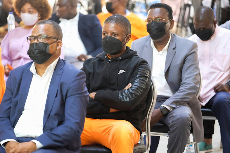 Ndambi Guebuza (in orange trousers), the son of Mozambique's former President Armando Guebuza who was sentenced to 12 years in prison on charges relating to the $2 billion "hidden debts" case that rocked the country's economy listens to the verdict at Machava B Maximum Security Prison near Maputo, Mozambique December 7, 2022.