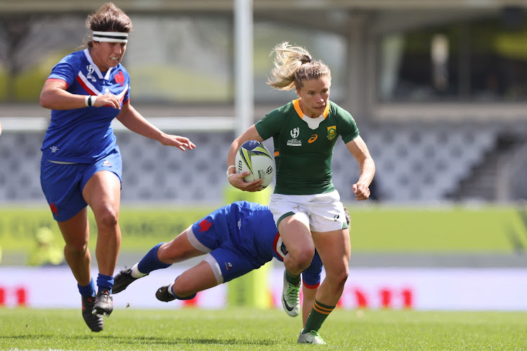 Nadine Roos of South Africa is tackled by Laure Sansus of France during the Pool C Rugby World Cup 2021 match at Eden Park on Saturday.