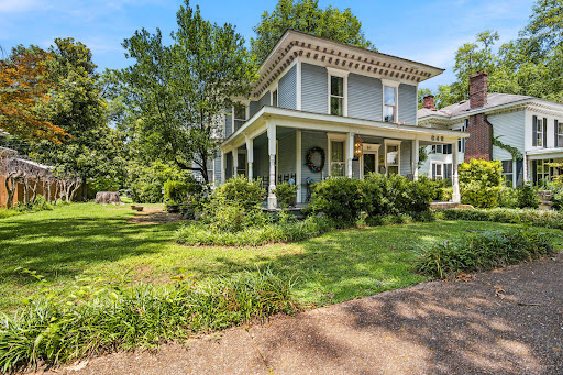 Blue Victorian house with porch and garden in this luxury house for sale in Decatur ($240,000 - 222 m²)