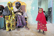 Somali parents with their sick children at a makeshift hospital in Mogadishu set up by South Africa's Gift of the Givers