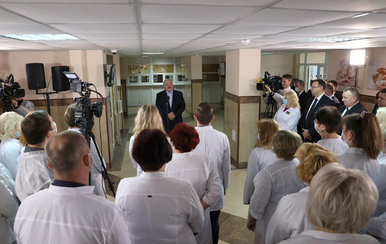 Belarusian President Alexander Lukashenko meets with medical workers as he visits a local hospital in the town of Stolbtsy in Minsk Region, Belarus December 8, 2020.