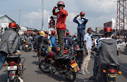 Activists gesture as they march during a demonstration calling for an end to the fighting between the M23 rebels and the Congolese army and denouncing the international community's silence on the conflicts in Goma, North Kivu province of the Democratic Republic of Congo on February 19 2024.  