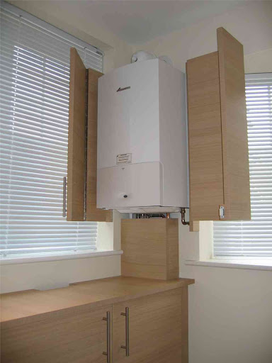 Hinged boiler cover made to match kitchen.