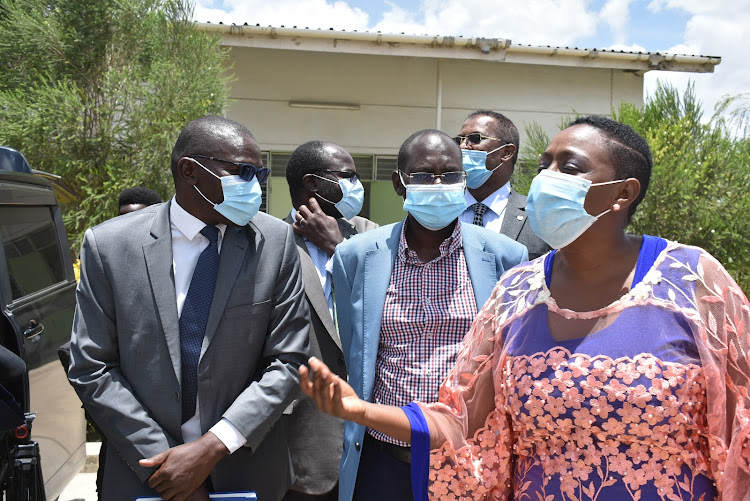 From left is the head of the National Vaccines and Immunisation programme, Dr Collins Tabu, MPs Muriuki Njagagua and Sabina Chege at the national vaccines depot in Kitengela on MArch 24, 2021.