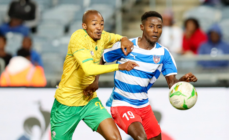 Murphy Dorley of Liberia challenged by Thapelo Morena of South Africa during the 2023 African Cup of Nations Qualifiers match between South Africa and Liberia at the Orlando Stadium, Soweto on the 24 March 2023.