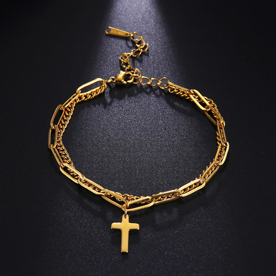 Bracelet chaîne double en acier titane tendance, soudure jumelée et croix. Accessoire parfait pour un look mode et audacieux.