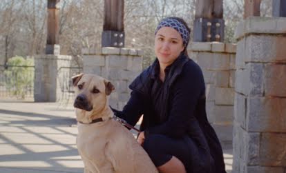 A woman with a dog who has shared details about her relationship to technology.