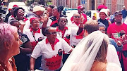 A wedding couple were serenaded by Nehawu members amid a protest outside home affairs in Cape Town on Monday, March 6 2023.