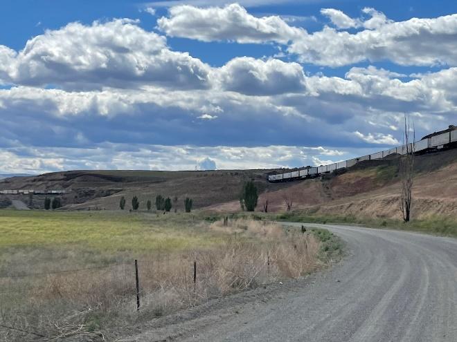 A picture containing grass, sky, outdoor, road

Description automatically generated