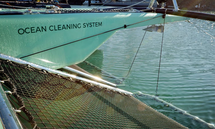 The Ocean Cleaning System gives a second use to the traditional catamaran trampoline to act as a net to catch floating rubbish.