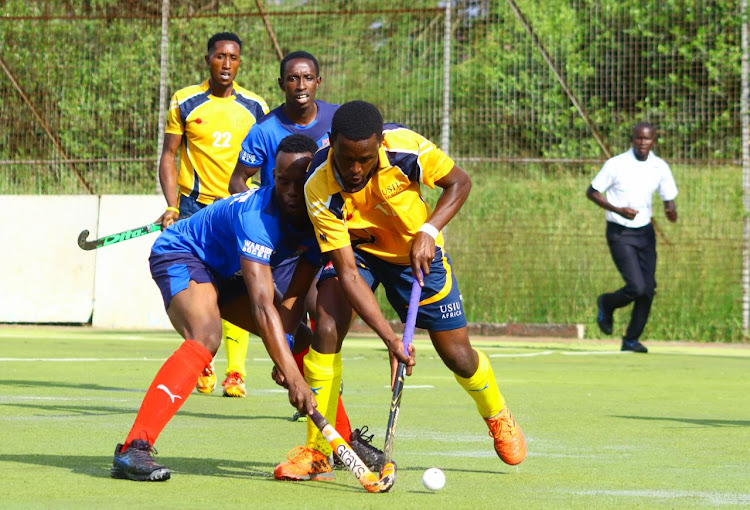 Mashujaa's Jamleck Macharia fights for the ball with Vincent Odhiambo of Butali Warriors