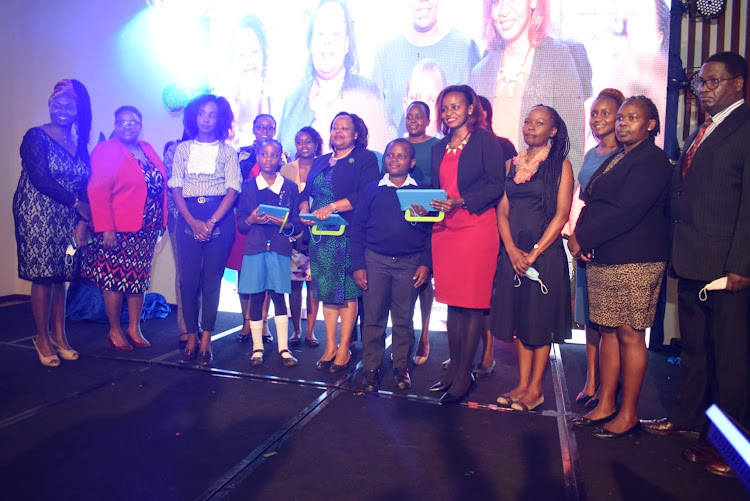 Communications authority officials among other key stakeholders from Global System for Mobile Association (GSMA) take a photo op during the launch of an online game dubbed “Cyber Soldjas" on the marking of the world Safer Internet Day at Movenpick Hotel, Westlands on Tuesday, February 8.