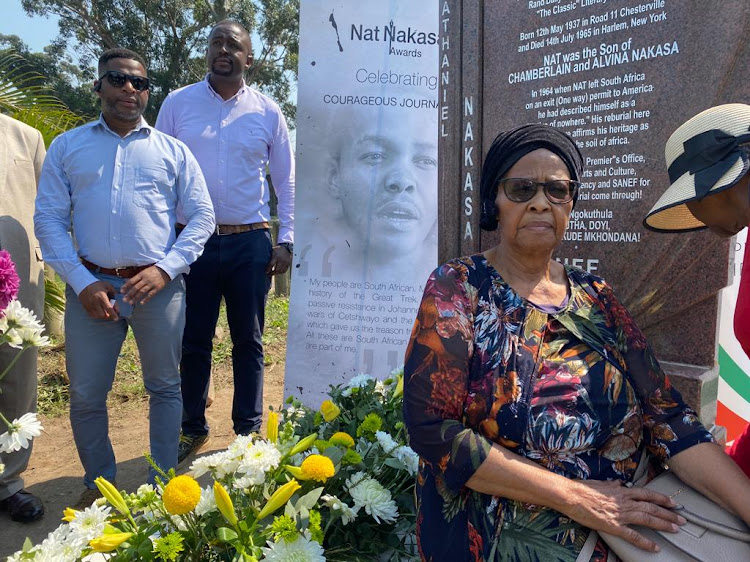 Gladys Maphumulo, sister of the late journalist Nat Nakasa, at his tombstone, which has been refurbished after being vandalised earlier this year.