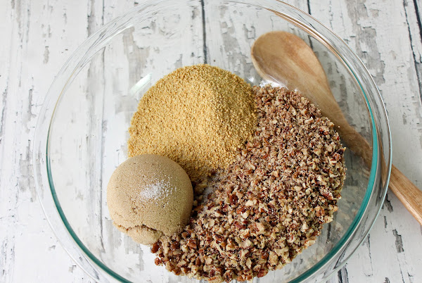 Pecans, graham crackers, salt, and brown sugar in a bowl.