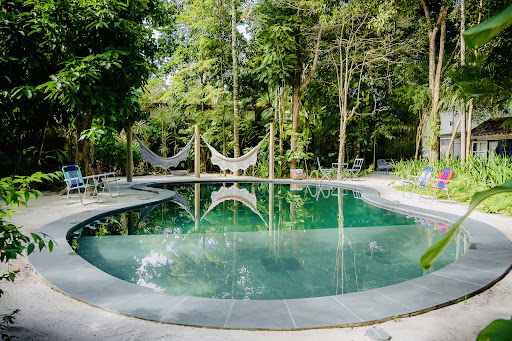 Outdoor pool with hammocks and loungers in this luxury house for sale in Trancoso (110 m²)