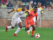 Mamelodi Sundowns attacking midfielder Lebohang Maboe (L) challenges Vusimusi Mngomezulu of Polokwane City during the Absa Premiership match at Peter Mokaba Stadium in Polokwane the on August 7 2018.