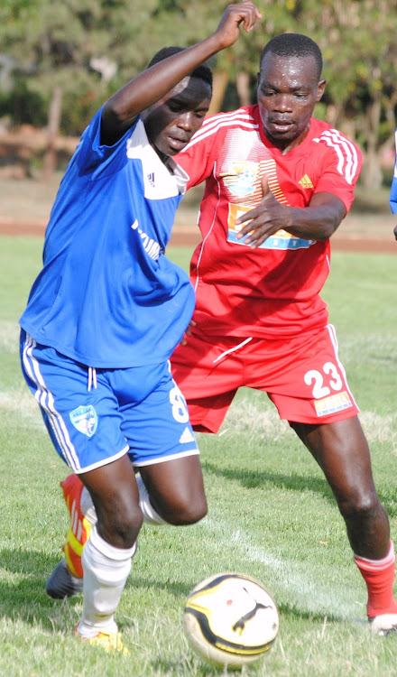 Posta Rangers' striker Dennis Mukaisi (L) shields the ball from Nakumatt's Christopher wekesa in a Past National Super League encounter