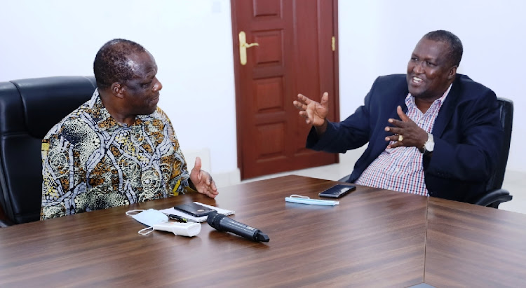 Kakamega governor Wycliffe Oparanya and Petroleum and Mining CS John Munyes in his office yesterday