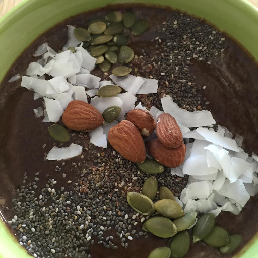 Purple Power Smoothie Bowl garnished with ground flaxseed, chia seeds, raw unsweetened coconut, pepitas, and raw almonds. Go with organic and raw ingredients whenever you can. I usually don't add sweeteners, the fruit makes them sweet enough for me. 