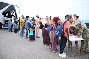 American nationals arrive for evacuation from the port, as clashes between the paramilitary Rapid Support Forces and the Sudanese army continue, in Port Sudan, Sudan, April 30, 2023. 