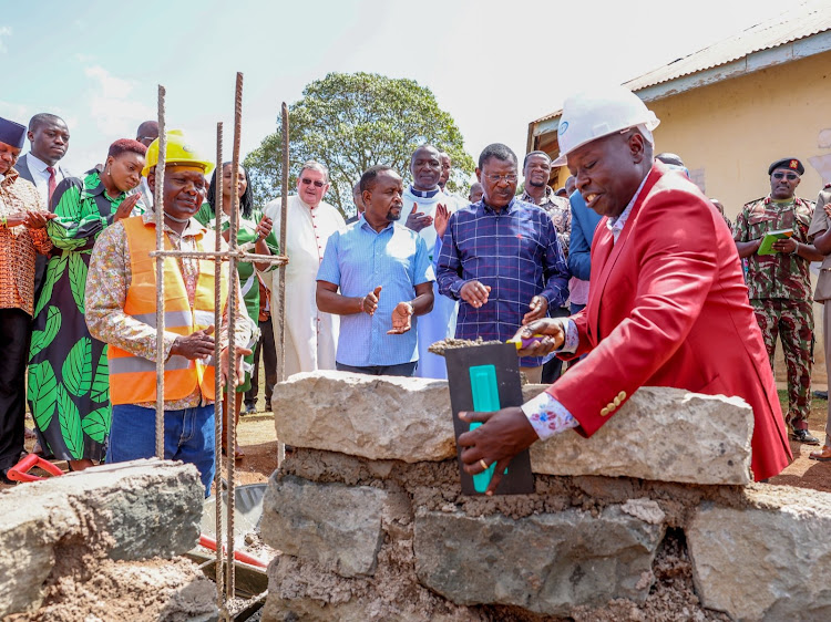 Deputy President Rigathi Gachagua laying a foundation at St Andrew Kaggwa Catholic Church in Kwanza, Trans Nzoia County on February 11, 2024.