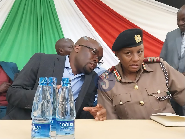 Interior PS Dr Raymond Omollo confers with the Nyanza Regional Commissioner Florence Mworoa during a security meeting at the Jaramogi Oginga Odinga University of Science and Technology (JOOUST) on July 26, 2023