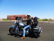 Miles Osler outside the Painted Desert Inn in the Petrified Forest National Park in eastern Arizona. The Petrified Forest is the only US national park that includes and protects a section of the historic Route 66.