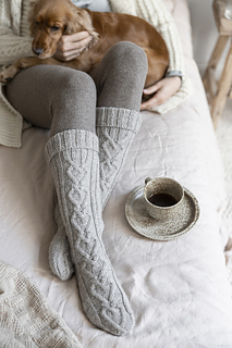 woman wearing long cable knit socks 