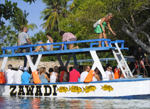 LOW TURNOUT: Tourists in a boat ride at the Mida Creek in Watamu last week.Photo/Alphonce Gari