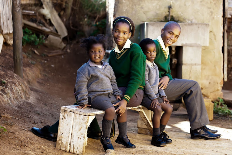 Children dressed in school uniforms. IMAGE: Stock Photo