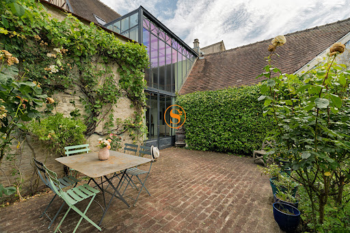 Brick patio with outdoor furniture in this luxury house for sale in Senlis ($1,463,704 - 325 m²)
