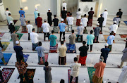 Indonesian Muslims offer Eid al-Adha prayers at the mosque amid a surge of coronavirus disease (Covid-19) cases in Bogor, on the outskirts of Jakarta, Indonesia, July 20, 2021. 